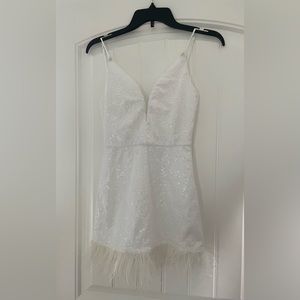 White sequin dress with feathers